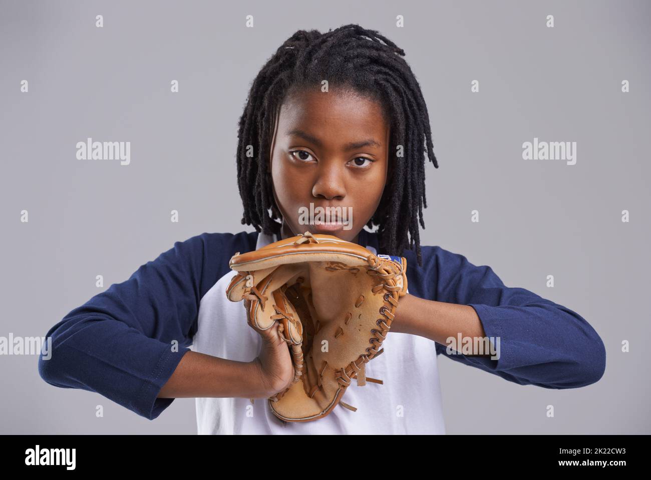 Lets end your game. Studio shot of a young boy with baseball gear. Stock Photo