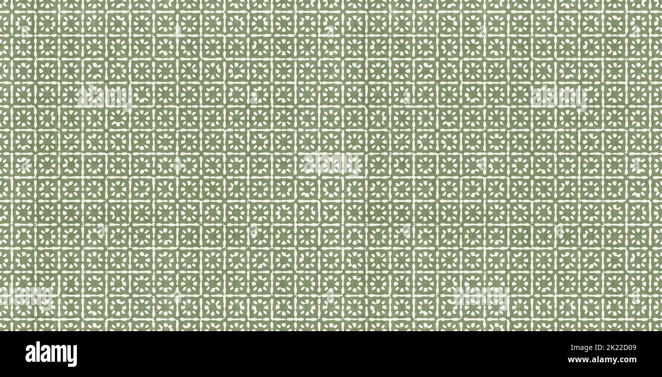 Batik small floral or sun motif in geometric squares on distressed boho textured linen in sage green and natural white. A fashion or interior design r Stock Photo