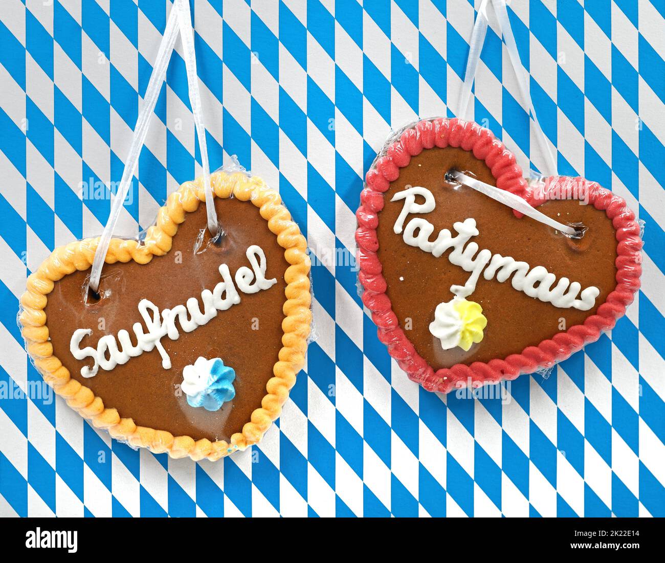 traditional gingerbread heart with funny german nicknames on bavarian white blue diamond pattern background Stock Photo