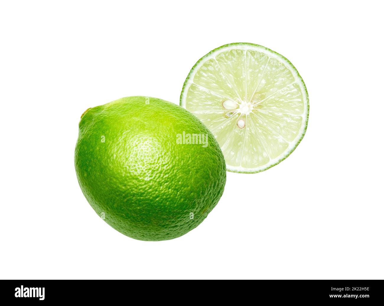 Whole and cut slice fresh lime isolated Stock Photo