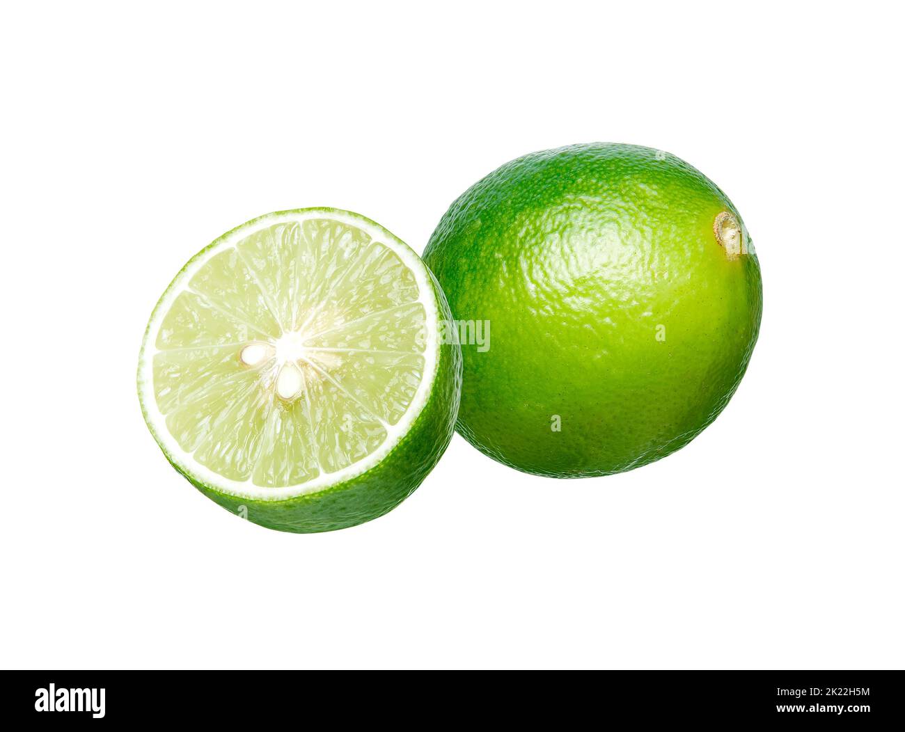Whole and half fresh lime isolated Stock Photo