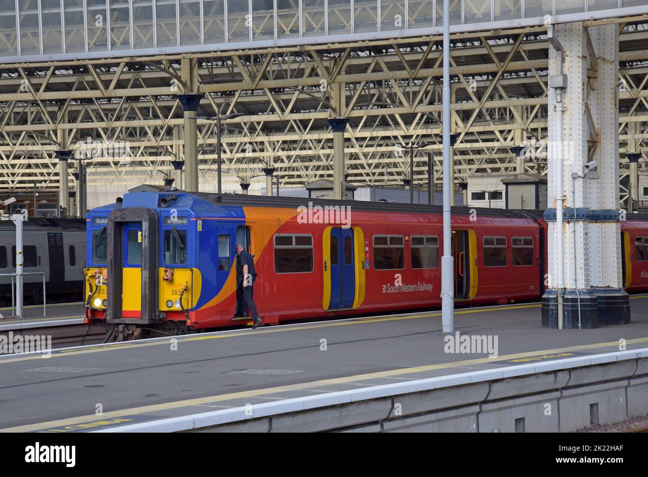 Train driver getting into the cab of a Class 455 South Western Railway