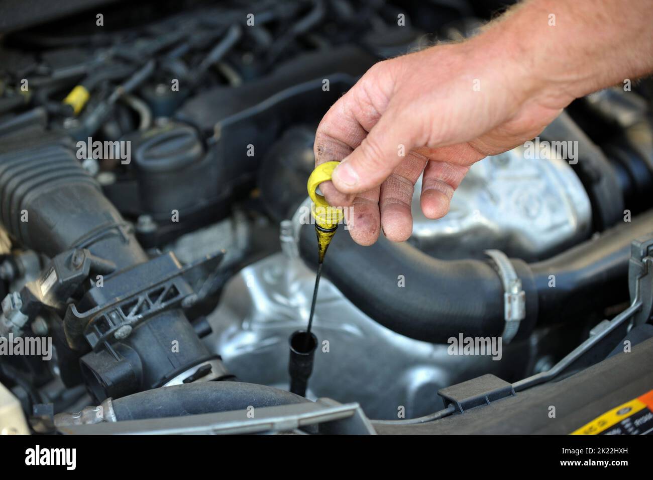 Undated file photo of a man carrying out car maintenance. Drivers have serious concerns about Government proposals to relax MOT rules to ease the cost-of-living crisis, a new survey suggests. More than half of respondents (55%) to an RAC poll of 1,435 motorists said they felt halving the frequency of the vehicle examinations from every year to every two years was a bad idea. Issue date: Thursday September 22, 2022. Stock Photo