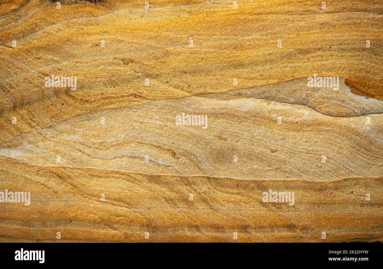 The individual layers of sandstone deposited in a shallow marine environment during the Jurassic era are clearly visible. Stock Photo