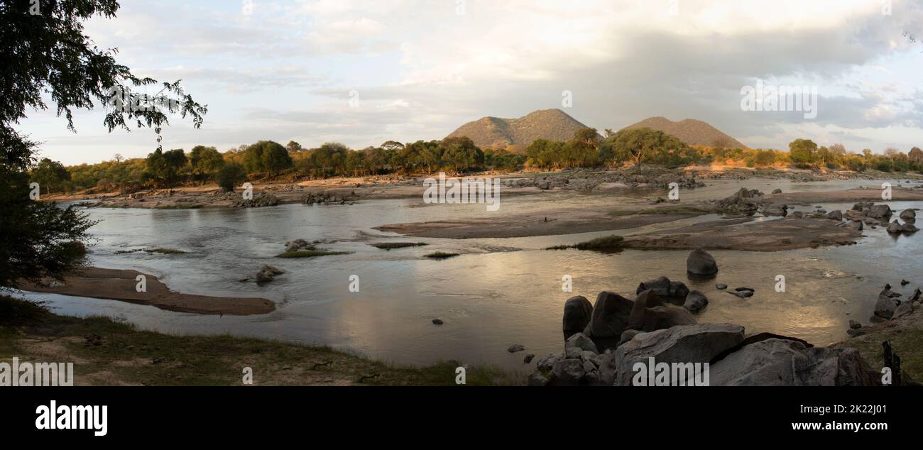 Late afternoon light on the Great Ruaha River. 2022 was not a good rainfall year for the catchment of the Great Ruaha River Stock Photo