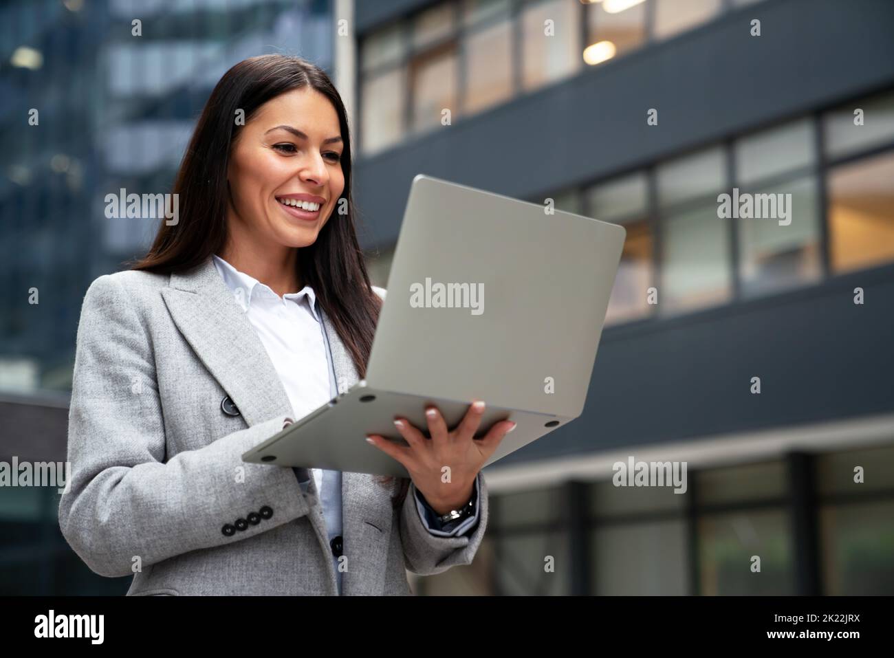 Beautiful business professional woman in the city outdoor. Business work people lifestyle concept Stock Photo