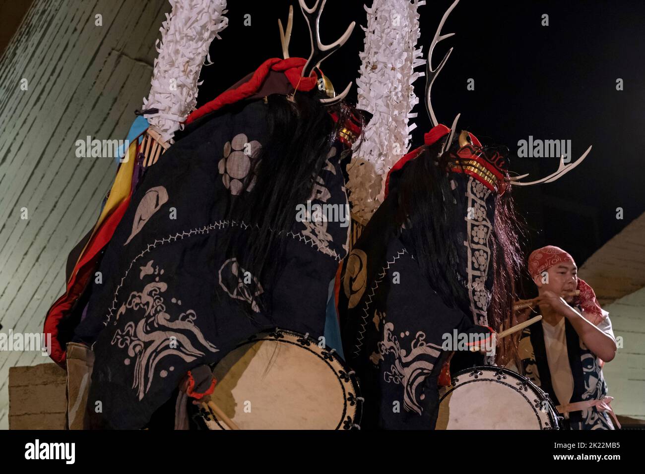 Japanese dancers perform the folk ritual Shishi-odori Deer dance in which dancers wear decorative deer heads with antlers during Israel Festival in Jerusalem. Originally,Shishi-odori belongs to Shinto (Nature worship) and was ancient ritual for nature gods and hunted animals. Stock Photo