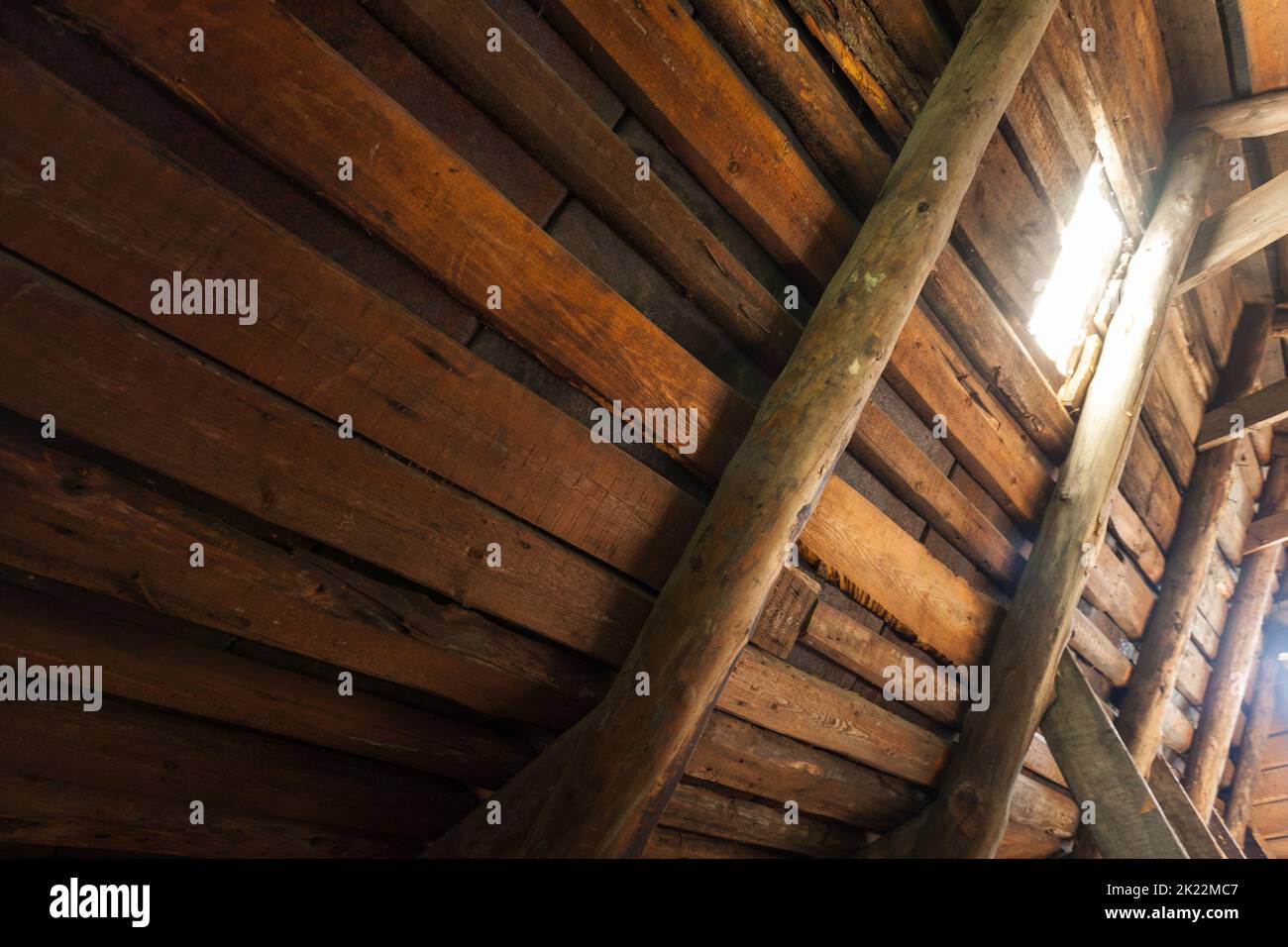 Abstract grunge wooden interior, glowing light window in an attic room Stock Photo