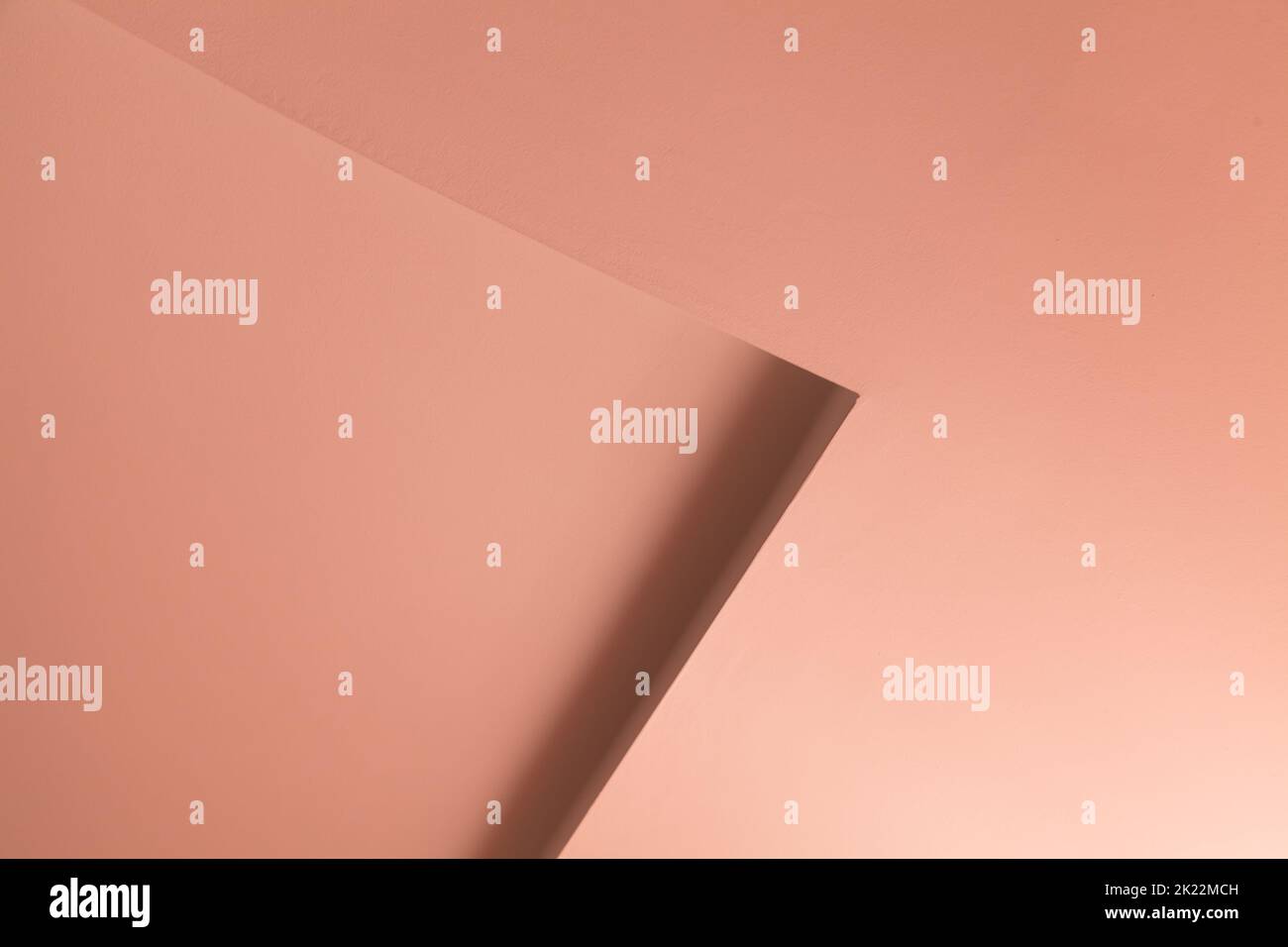 Abstract architecture background, pink interior fragment with a niche corner in the wall Stock Photo