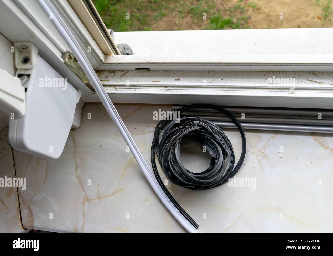 Replace rubber seal on window Stock Photo Alamy