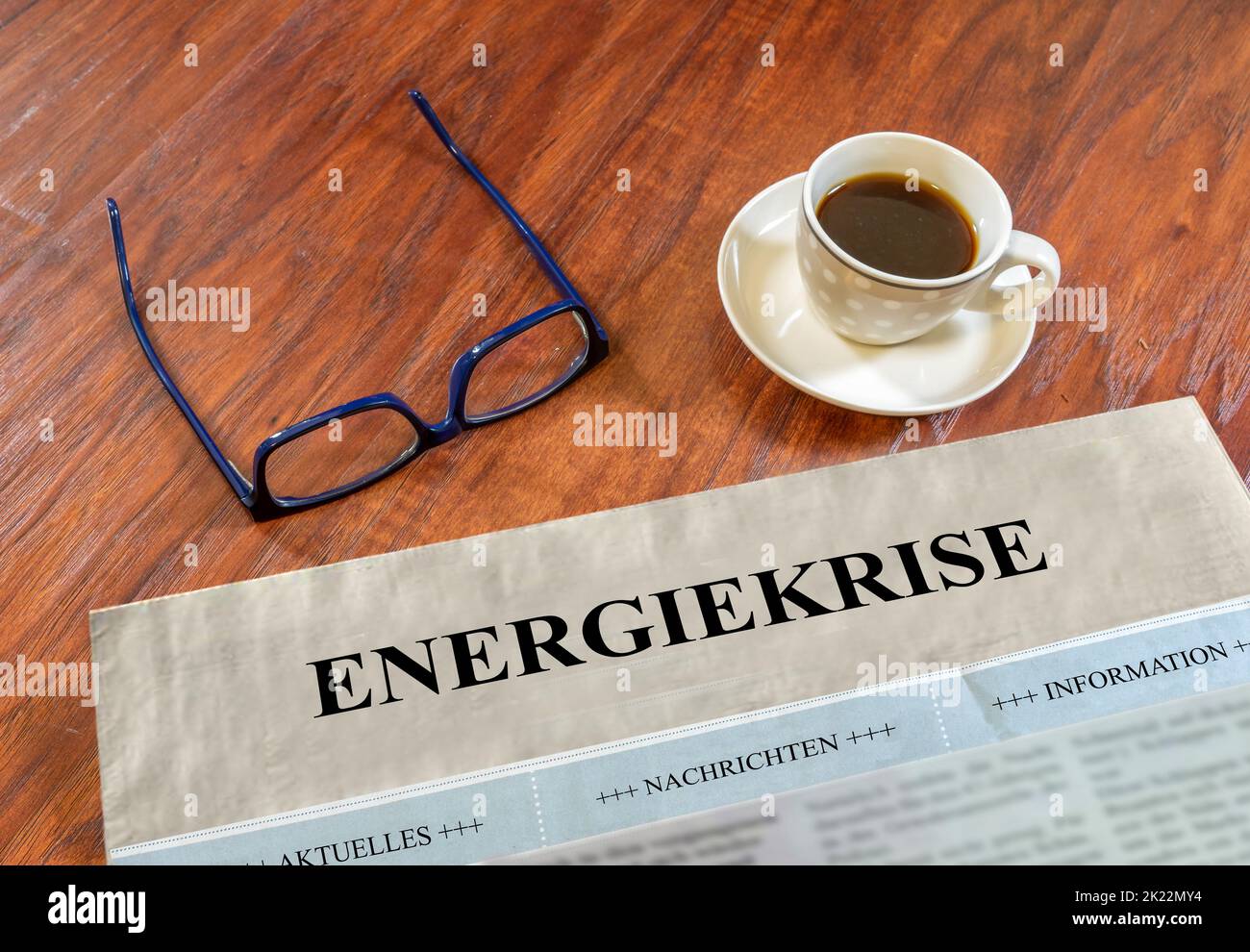 Energy crisis newspaper with glasses and coffee on a desk Stock Photo