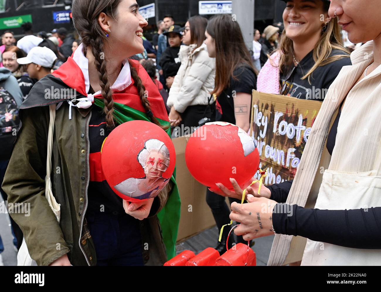 Protesters hold balloons with an image of Britain's Queen Elizabeth during a protest to 'abolish the monarchy' on the country's national day of mourning for her, in Sydney, Australia, September 22, 2022.  REUTERS/Jaimi Joy Stock Photo