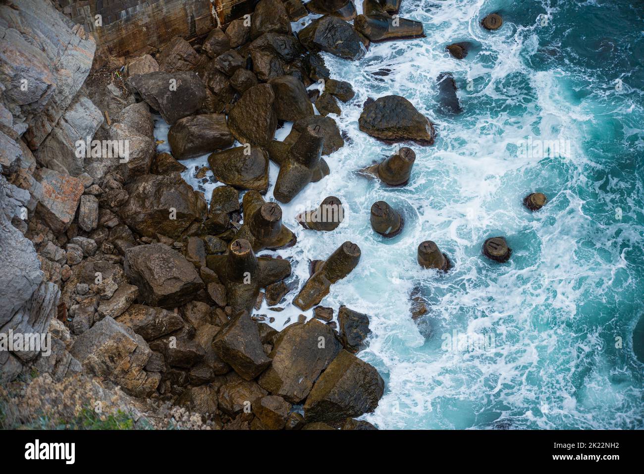 An aerial view of sea waves splashing against rocks Stock Photo - Alamy