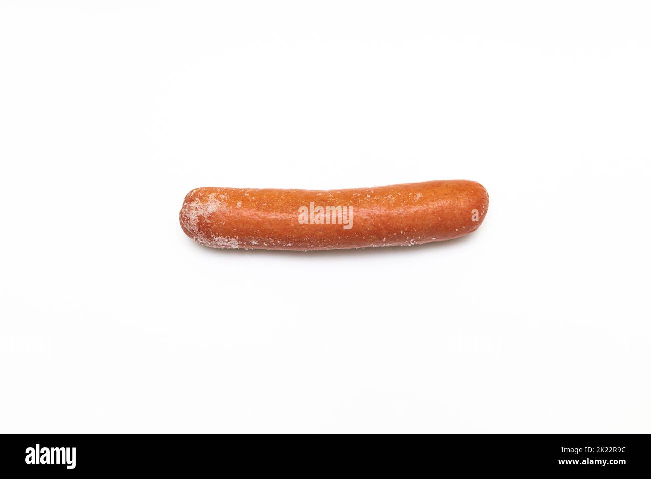 frozen sausage with traces of frost on a white background. frozen