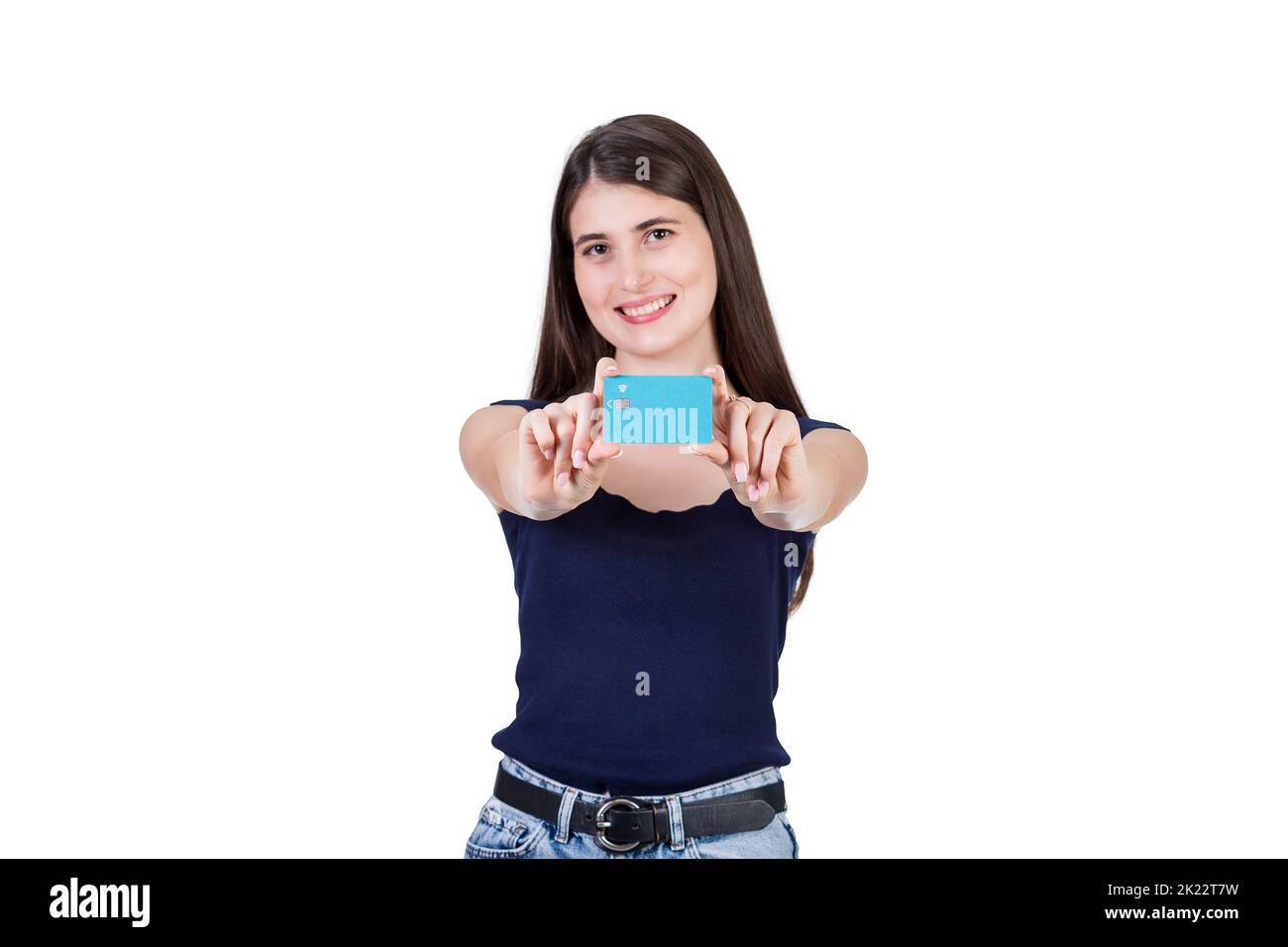 Contented young woman presents a credit card to camera, isolated on white background with copy space. Girl advertising her favorite bank, financial co Stock Photo