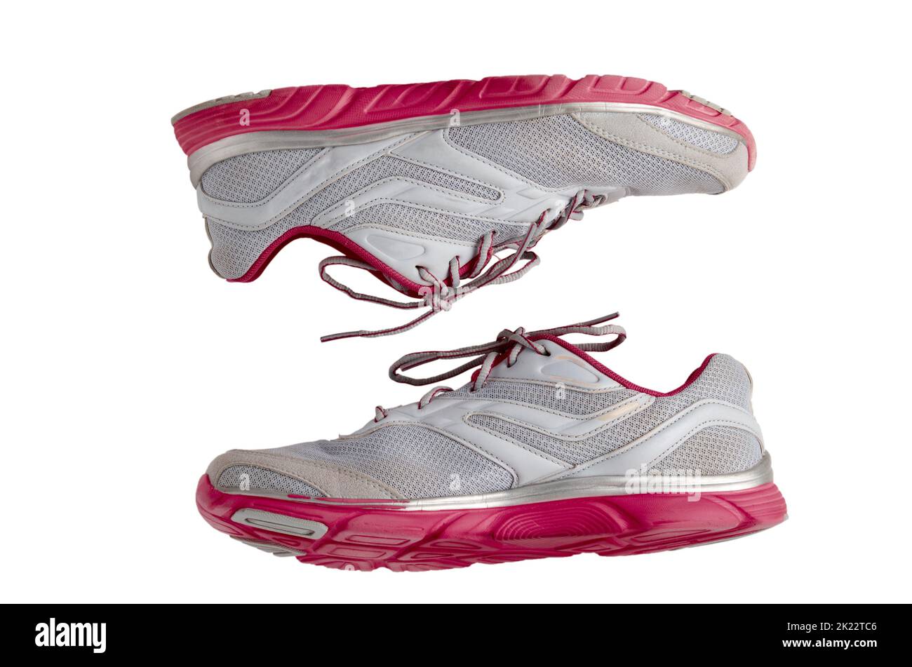 Pair of pink sport shoes isolates on white background Stock Photo - Alamy