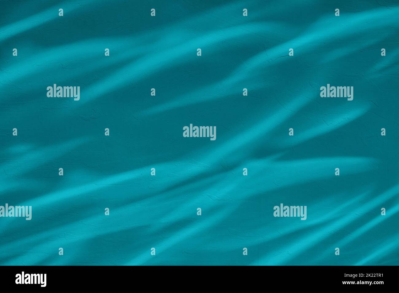 Shadow and light water caustic effect on blue concrete wall Stock Photo