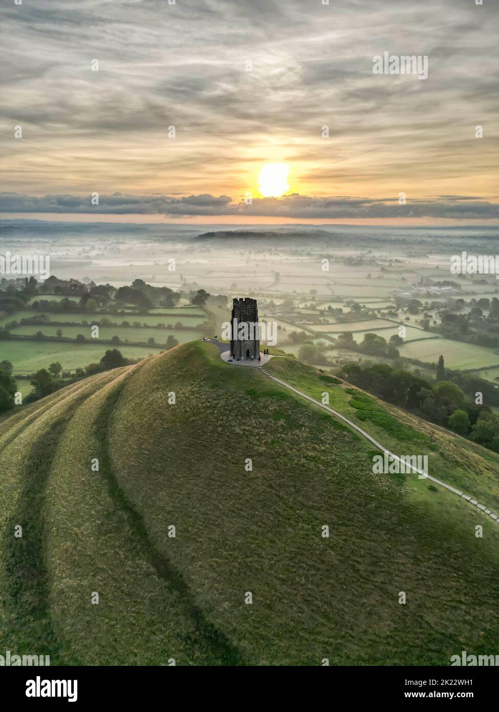 View from the air of a misty autumn sunrise at Glastonbury Tor at Glastonbury in Somerset.  Picture Credit: Graham Hunt/Alamy Stock Photo