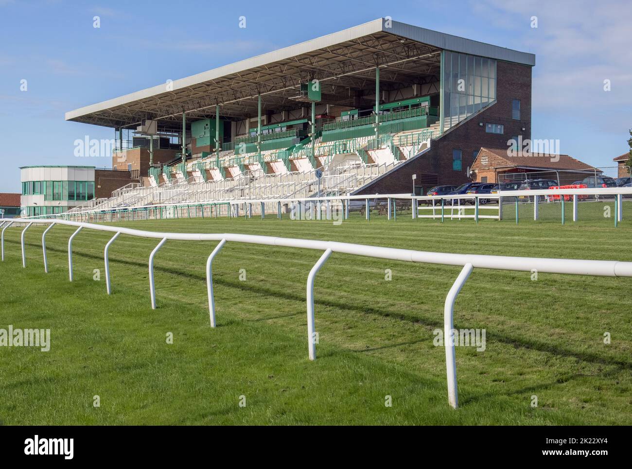 the grandstand at brighton racecourse on the edge of the south downs in
