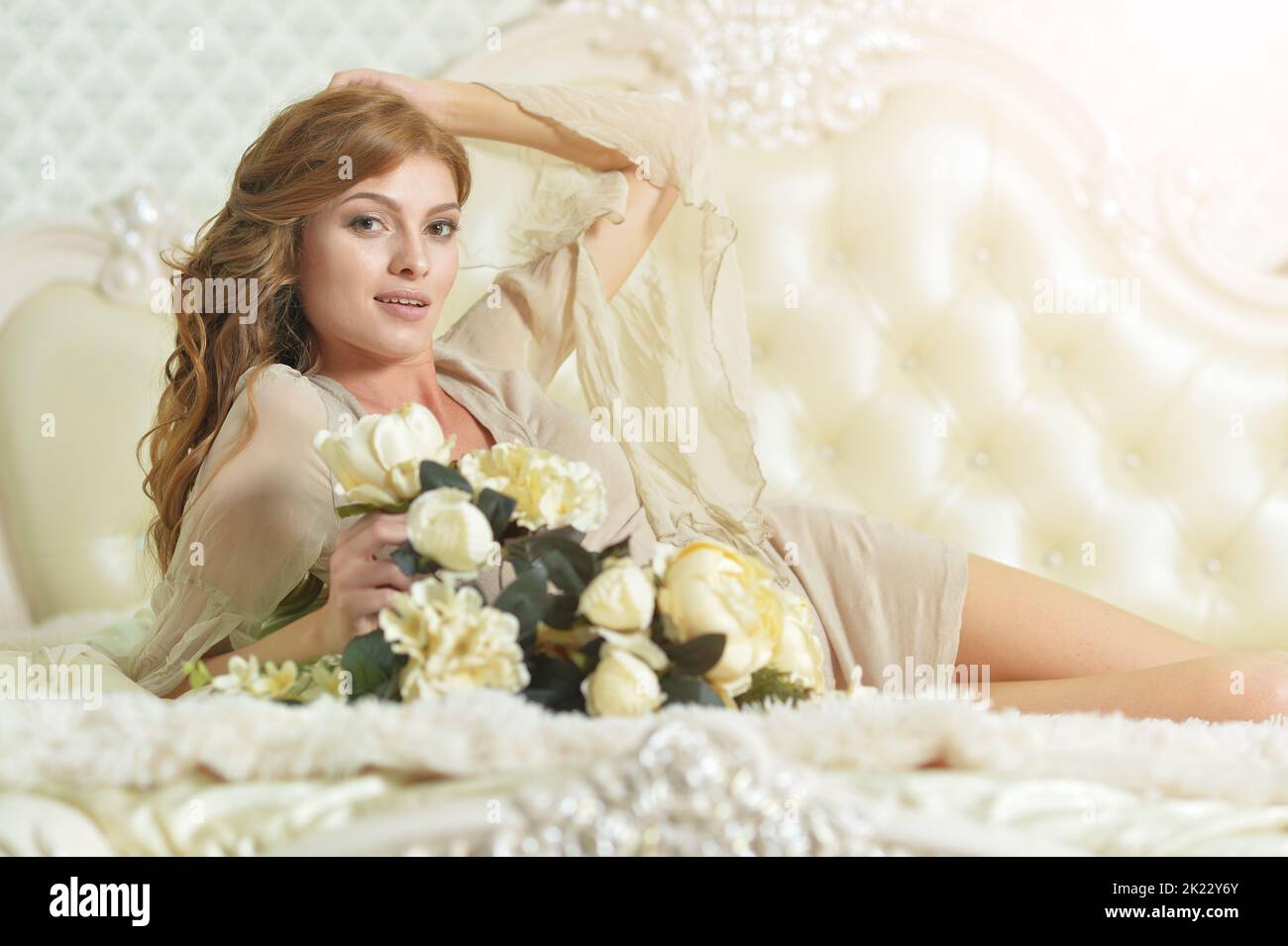 Young beautiful woman waking up on bed Stock Photo