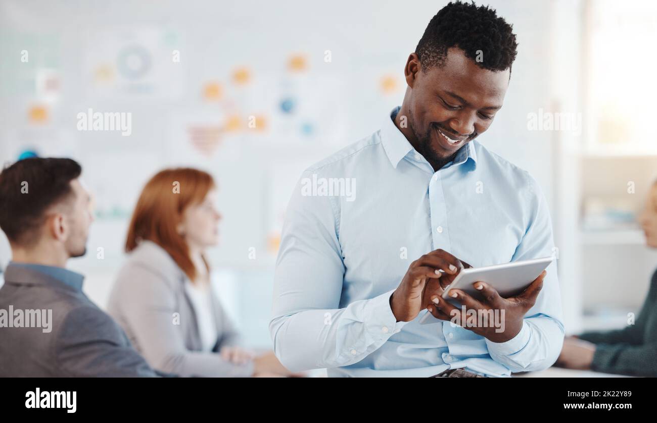 Corporate man and business news on tablet for career development convention social media marketing. Young black person busy with online research for Stock Photo