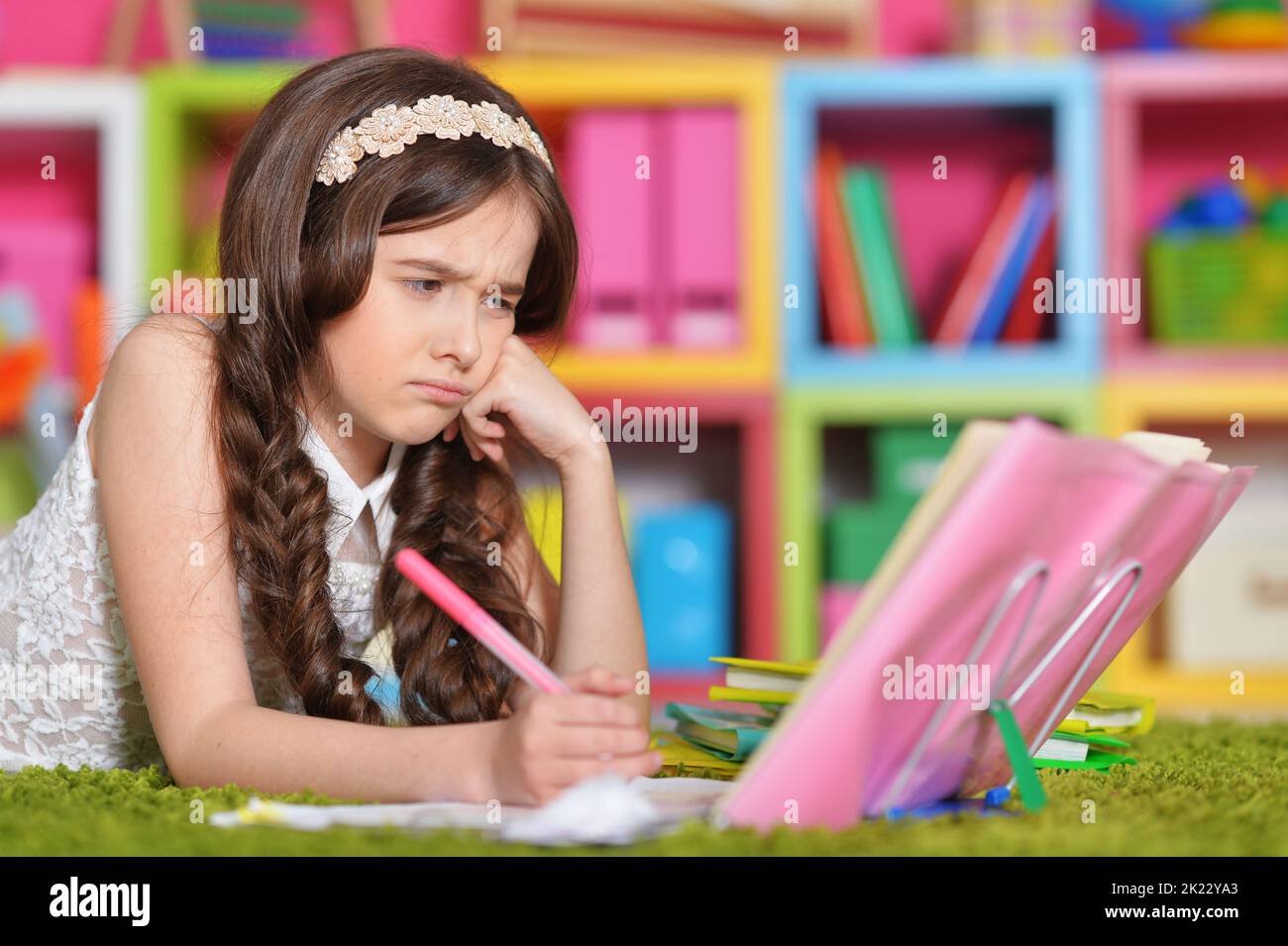 Portrait of cute little girl study at home  Stock Photo