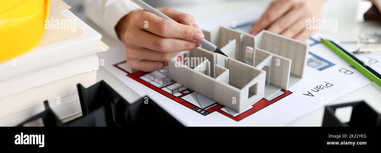 Architect shows layout of house or apartment closeup Stock Photo