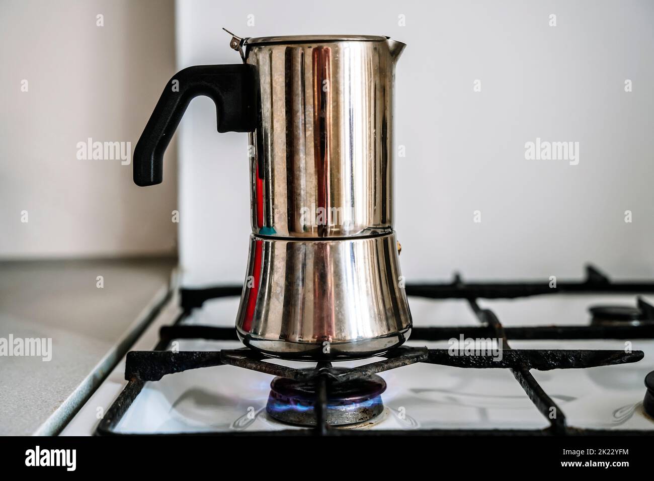 Metal coffee maker for brewing espresso coffee on the stove. Alternative brewing methods. High quality photo Stock Photo