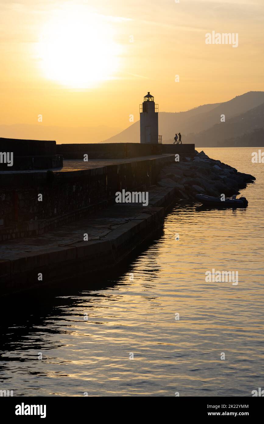 People enjoying Sunset in Camogli, a fishing village and tourist resort close to the peninsula of Portofino, on the Golfo Paradiso in the Riviera di L Stock Photo