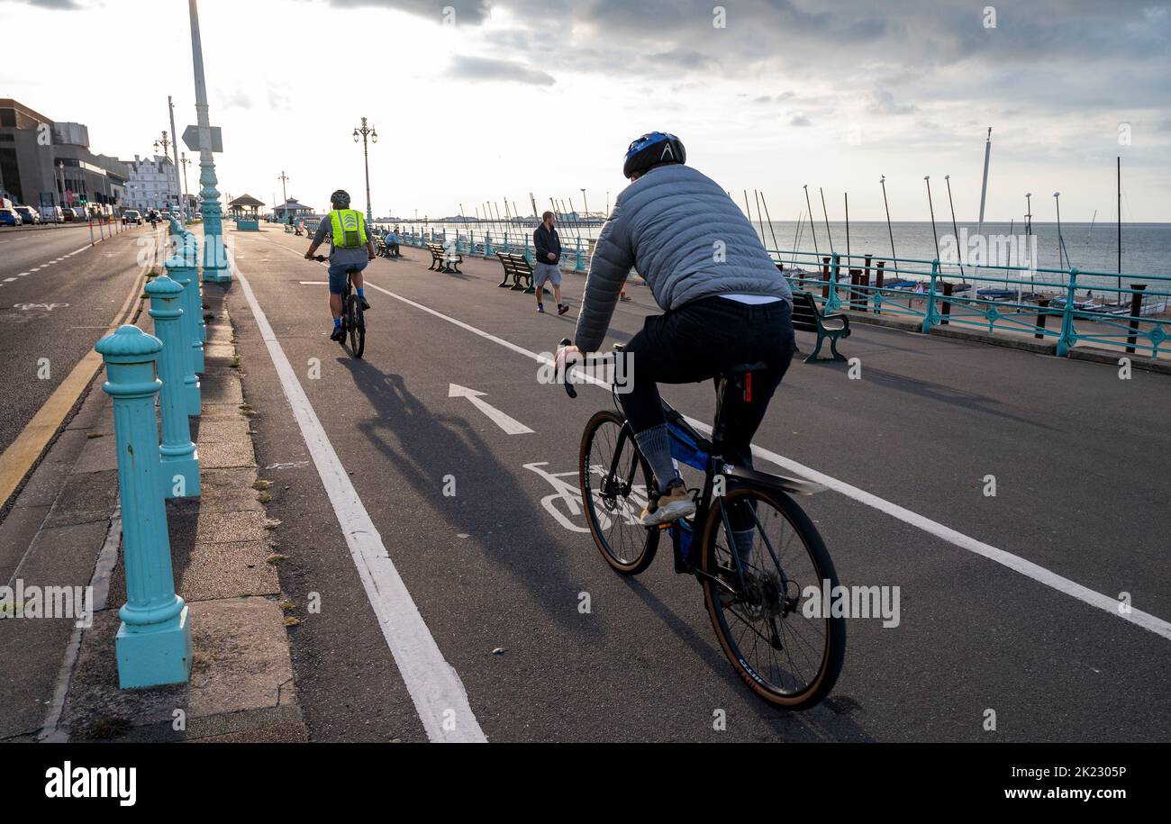Brighton UK 22nd September 2022 - Cyclists travel along Brighton seafront on Car Free Day . Car Free Day is celebrated across the world on or around 22 September and encourages people to walk, cycle or use public transport, instead of using their car for the day.  . : Credit Simon Dack / Alamy Live News Stock Photo