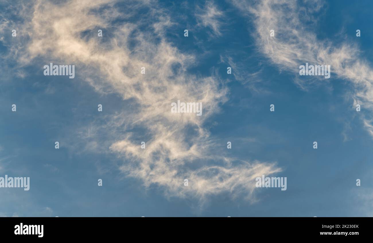 A Detailed Image Of White Wispy Cirrus Clouds Set Against A Blue Daytime Sky High Resolution Image Stock Photo