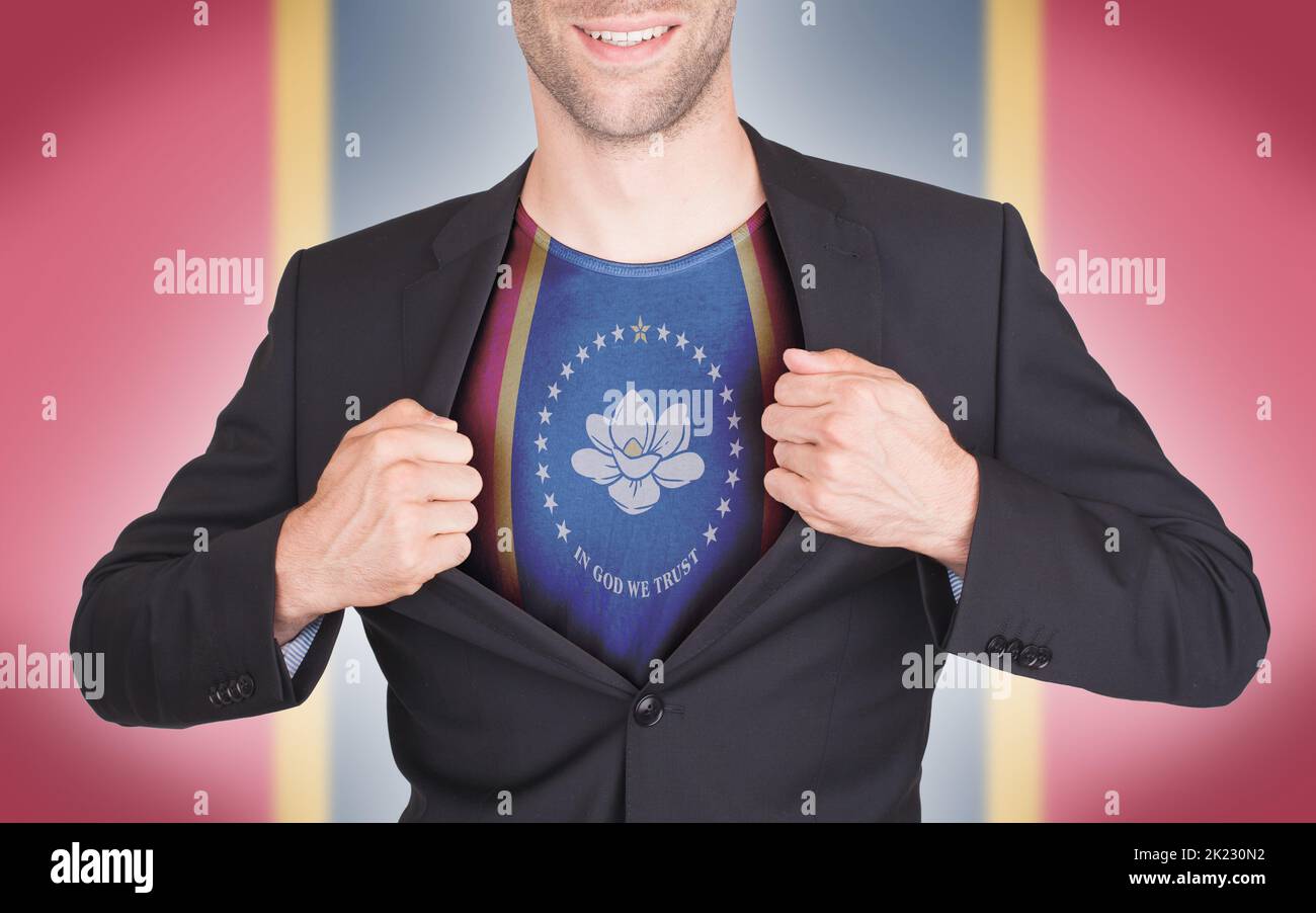 Businessman showing shirt with the flag of Mississippi, isolated Stock Photo