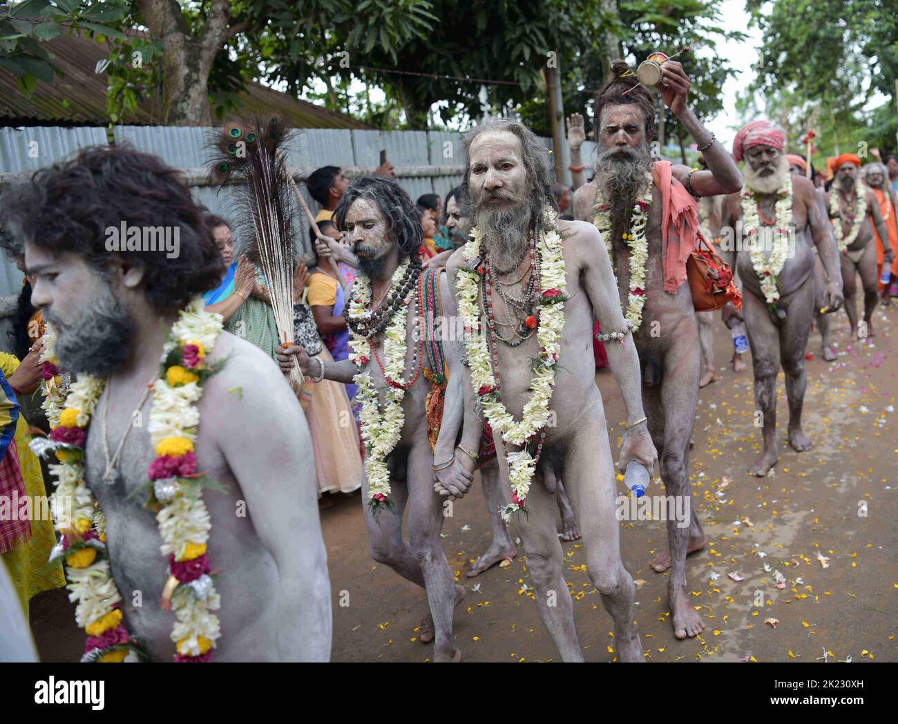 Naga Sadhus (Naked Yogis) perform different religious practices during 'Kumbh Mela' in Ranirbazar, Agartala. Kumbh Mela or Kumbha Mela is a major pilgrimage and festival in Hinduism. It is celebrated in a cycle of approximately 12 years, to celebrate every revolution Brihaspati completes. Tripura, India. Stock Photo