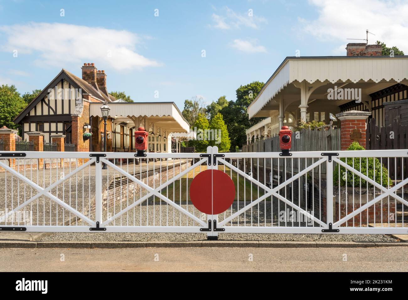 Level crossing gates outside the closed Royal Station at Wolferton on the Sandringham Estate, Norfolk. Stock Photo
