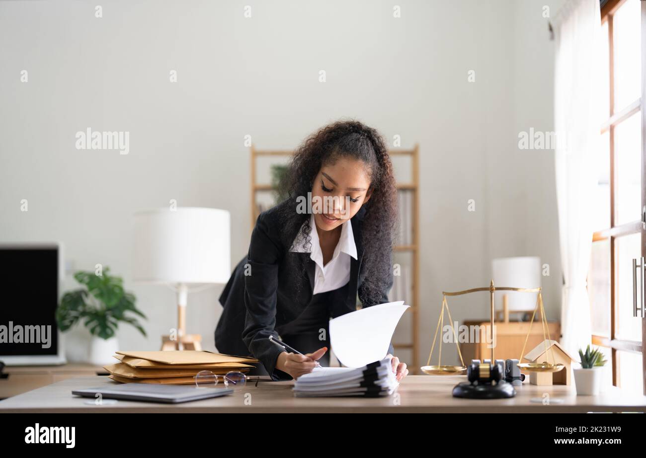 Judge gavel Justice lawyers, Business woman in suit or lawyer working on a documents. Legal law, advice and justice concept. Stock Photo