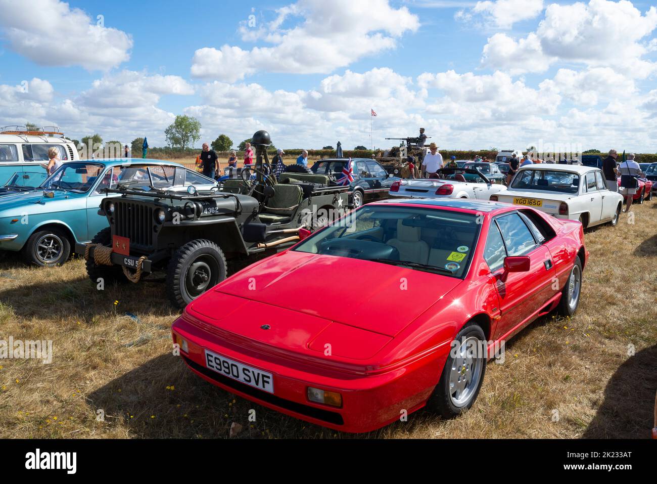 Cars on show at the Little Gransden Air and Car show, Bedfordshire, UK. 1988 Lotus Esprit with Willys MB Jeep and classic cars. Odd mix of vehicles Stock Photo