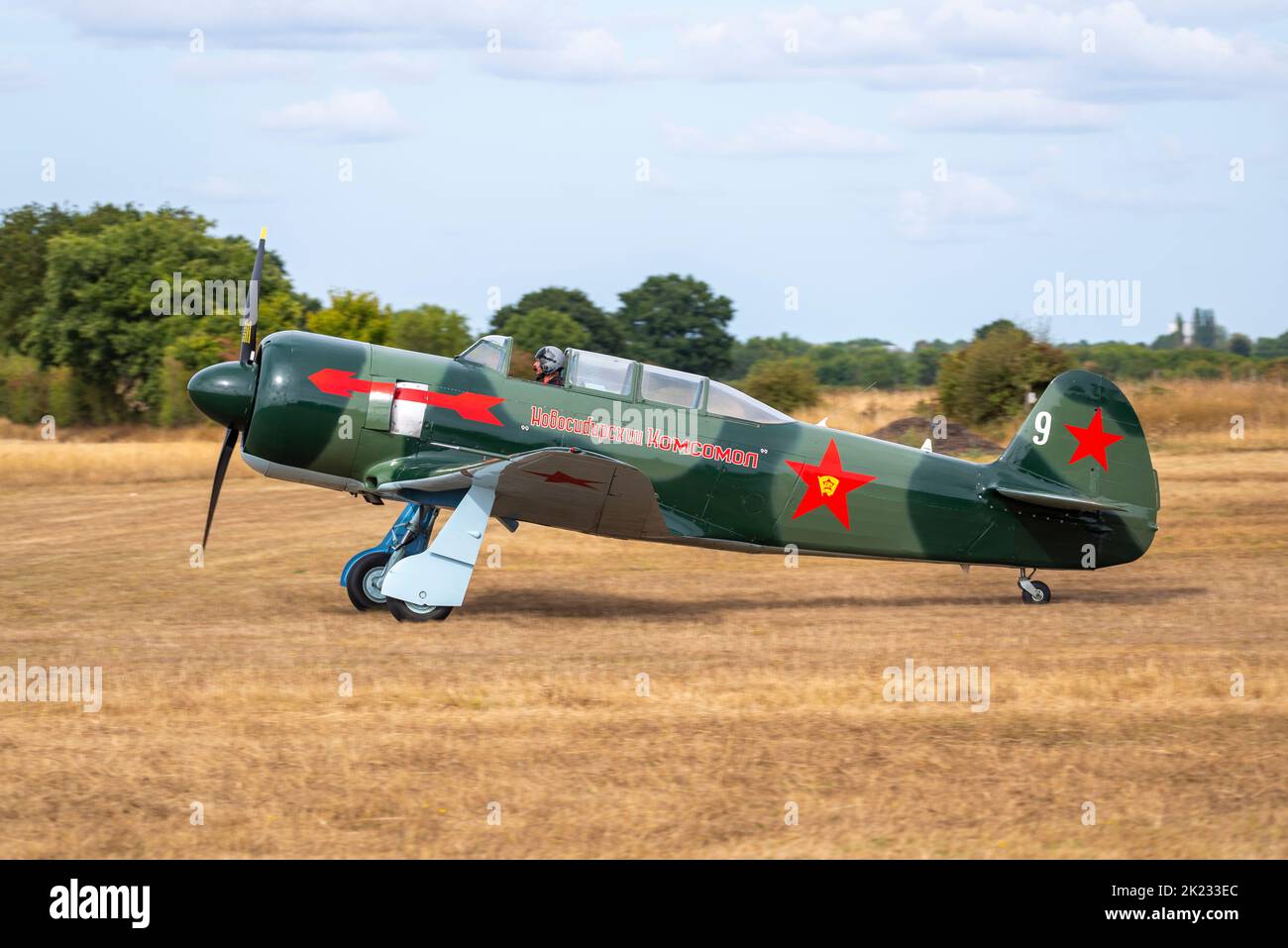 LET C.11 version of Yakovlev Yak-11 trainer plane at the Little Gransden Air and Car show, Bedfordshire, UK. G-OYAK white 9 Russian red star scheme Stock Photo