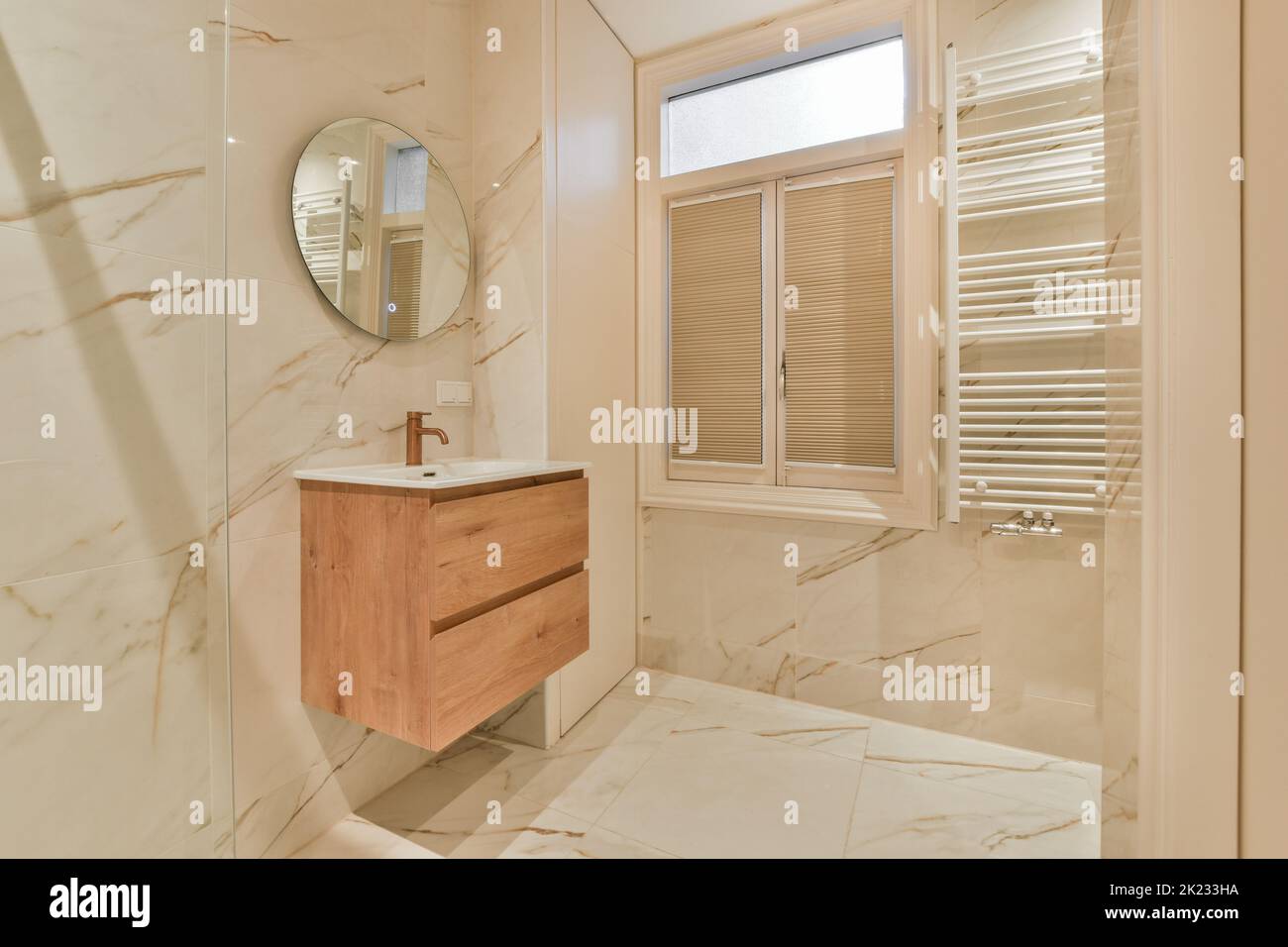 Glass partition between shower tap and wall hung toilet in modern