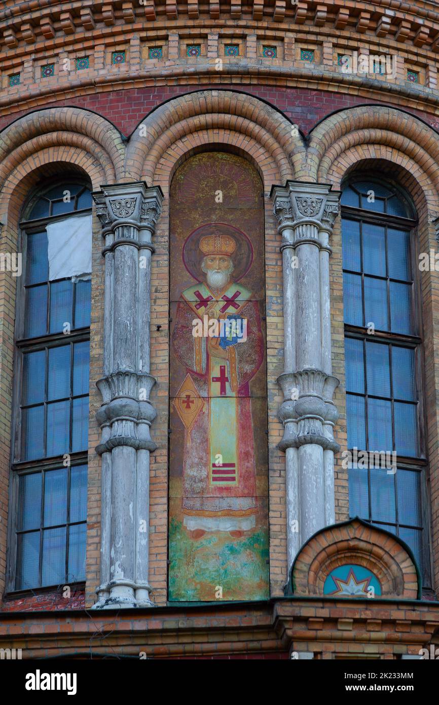 A fragment of the wall of an Orthodox church with the icon of St ...
