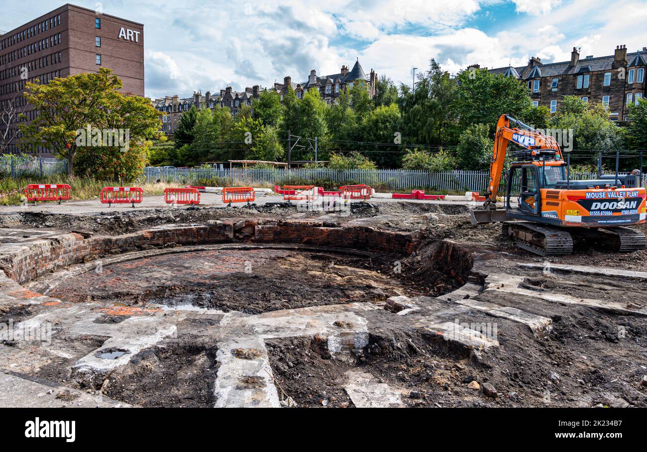 Unearthed remains of turntable with digger machinery at St Margaret's railway depot, Meadowbank, Edinburgh, Scotland, UK Stock Photo