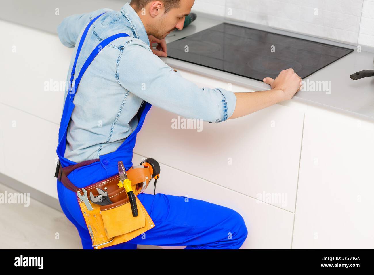 a worker repairs an electric stove, Induction Stove Stock Photo Alamy