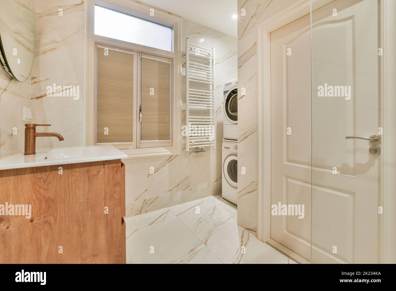 Glass partition between shower tap and wall hung toilet in modern