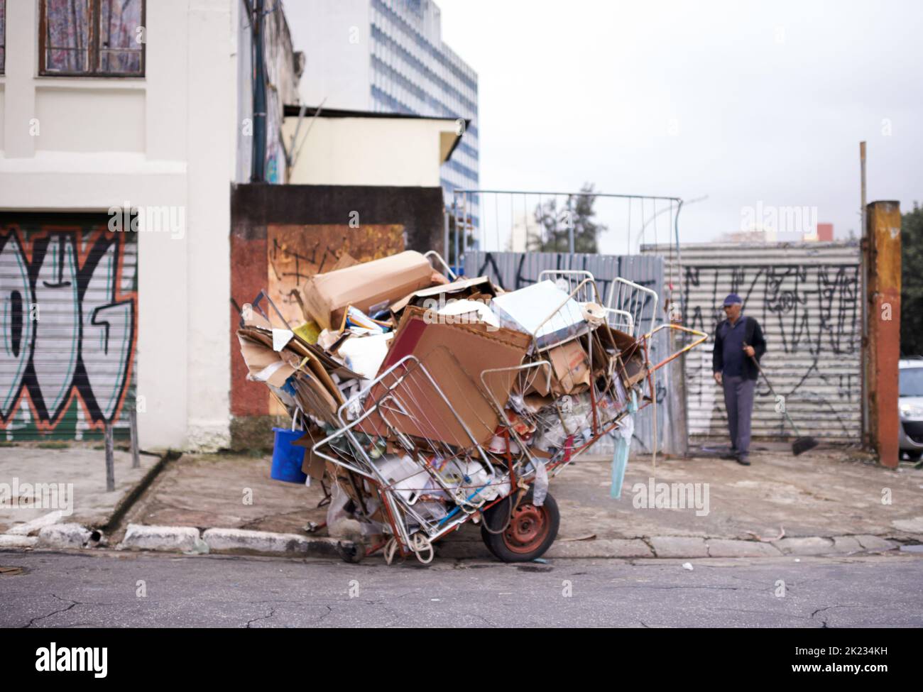 One mans garbage...a cart full of garbage in the street of a poor neighbourhood. Stock Photo