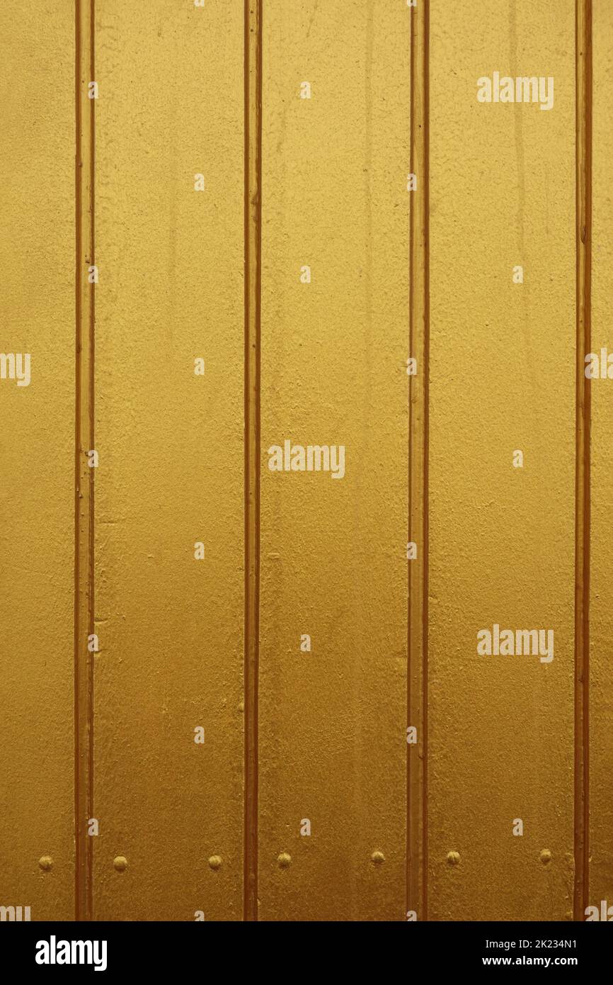 gold paint wood panelling or timber cladding background Stock Photo