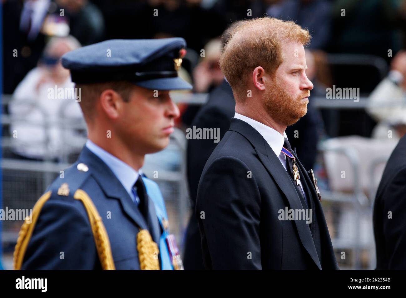 The State Funeral of Her Majesty Queen Elizabeth II, seen from The Mall. Prince William the Prince of Wales and Prince Harry Duke of Sussex walk behin Stock Photo
