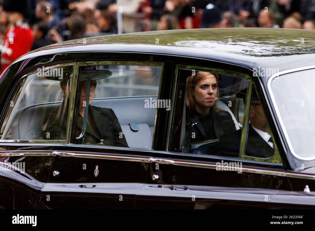 The State Funeral of Her Majesty Queen Elizabeth II, seen from The Mall. Princesses Beatrice and Eugenie are driven behind the coffin as Sailors of th Stock Photo