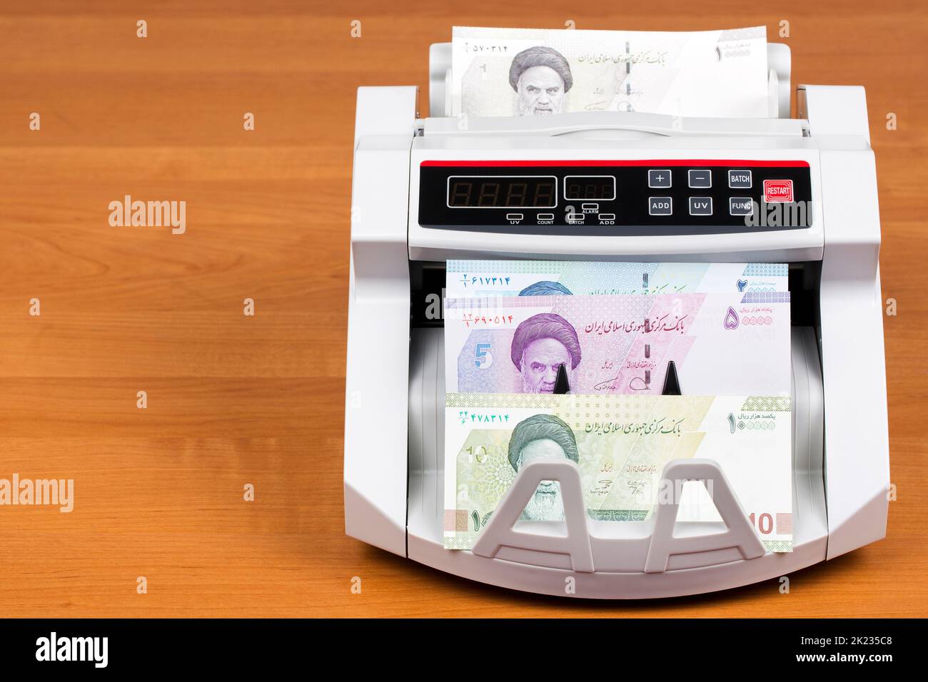 Iranian money - Toman in the counting machine Stock Photo