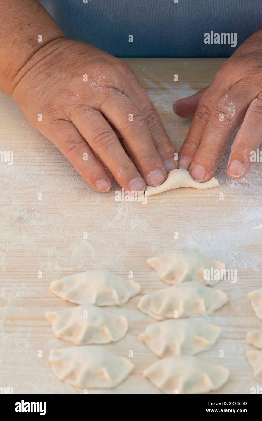 Italy, Lombardy, Crema, Hand Making Tortello Cremasco, Sweet Ravioli Stock Photo