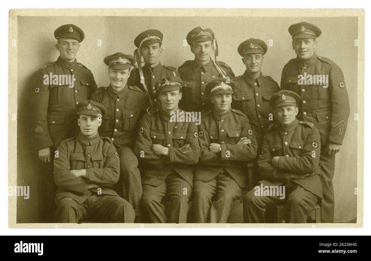 Original WW1 era studio portrait postcard of Royal Army Medical Corps (RAMC) army medical unit pals - jubilant and celebrating. Some have draped ribbons around their caps all are smiling and so happy. On reverse of postcard is 'taken at Ripon Armistice Day November 11th 1918'. Ripon, Harrogate, North Yorkshire, England, U.K. Stock Photo