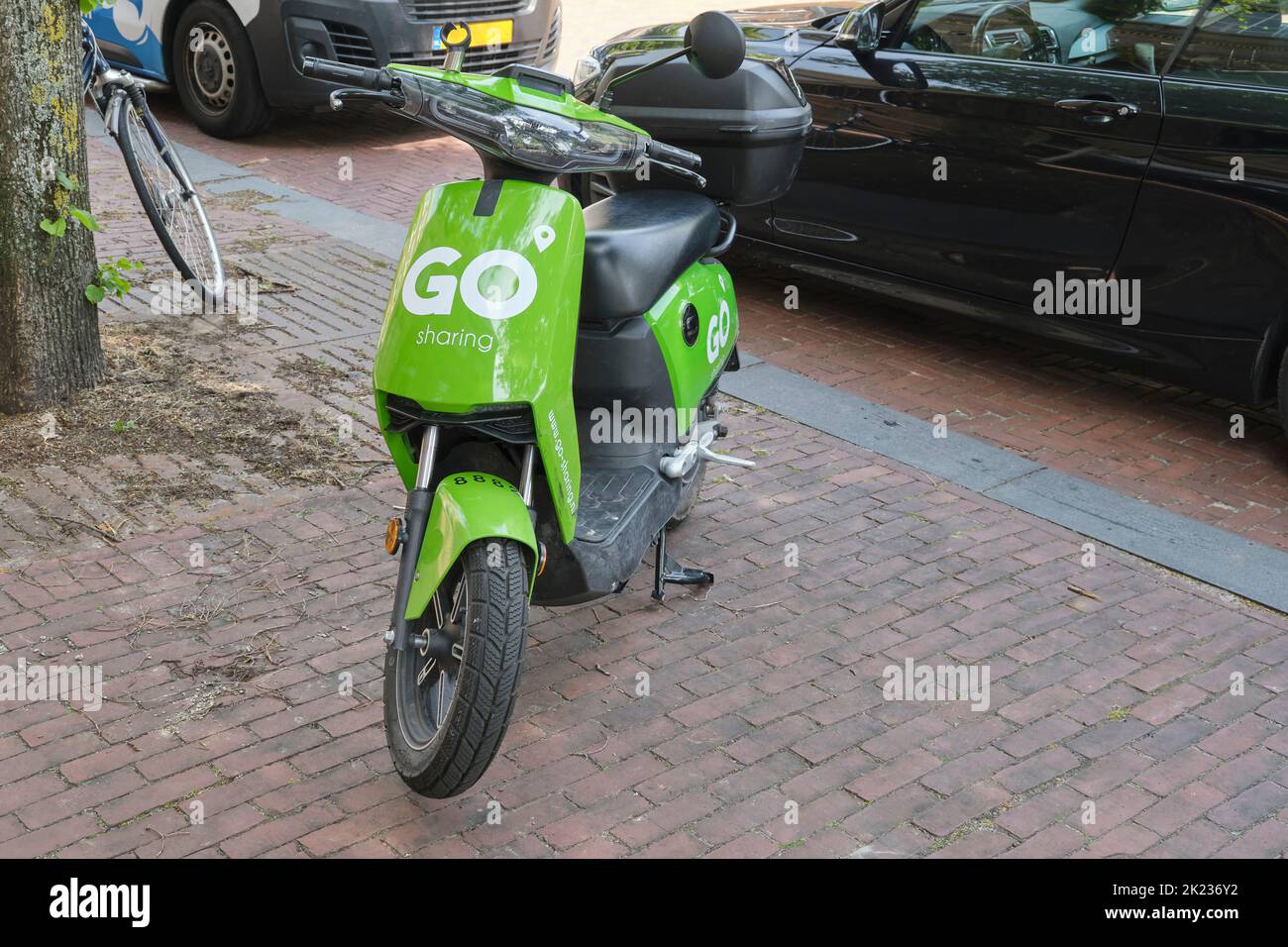 A green Go Sharing electrical scooter. GO Sharing is a micromobility